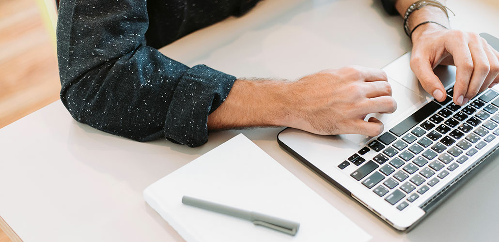 man donating on a laptop